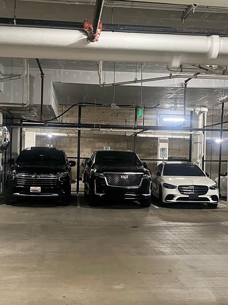 The Executive Ride USA fleet: black Chevrolet Suburban, black Cadillac Escalade and white Mercedes-Benz S-Class