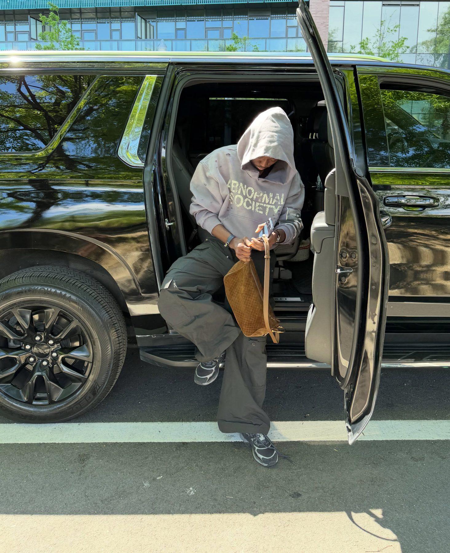A guest arriving by black SUV downtown